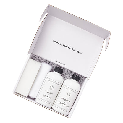 leather bag cleaning kit with cleaning cloth, sponge, protection cream and conditioner in open box