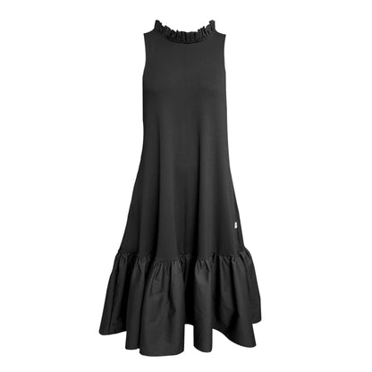 This is a midaxi style dress in black silhouetted against a white background facing the front. The dress is a midaxi length with pockets. It has a high neck with a row of ruffles. 