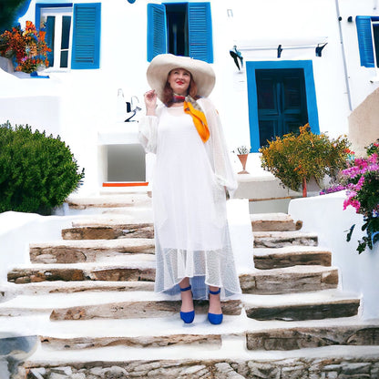 Women's Plus Size Aphrodite White Holiday Resort Dress with a white undergarment, paired with a white sunhat, the Cherry Blossom Silk Scarf and blue heels for a chic holiday look.