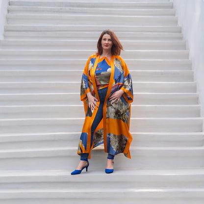 Bird of Paradise White Blue Cherry Blossom Silk Kimono paired with a Cherry Blossom Silk Scarf, as a top, featuring elegant cherry blossom patterns and vibrant colors. White Steps Background.