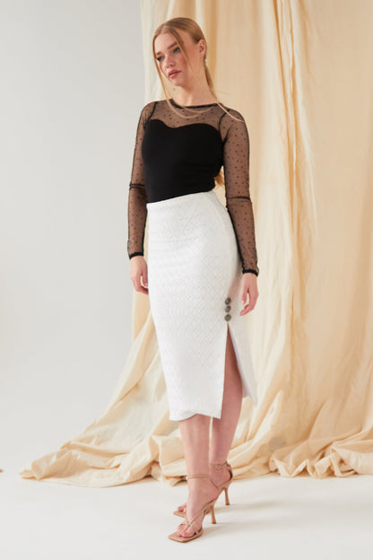 the model is wearing a Sarvin White Lace Bodycon Skirt and black top.