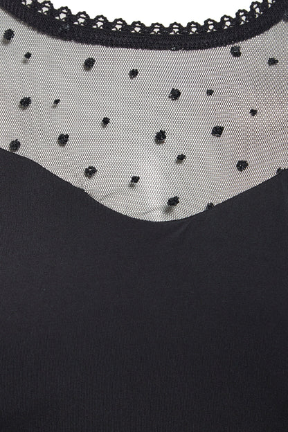 A close up of a Sarvin Long Sleeve Glitter Mesh Bodysuit with beading.