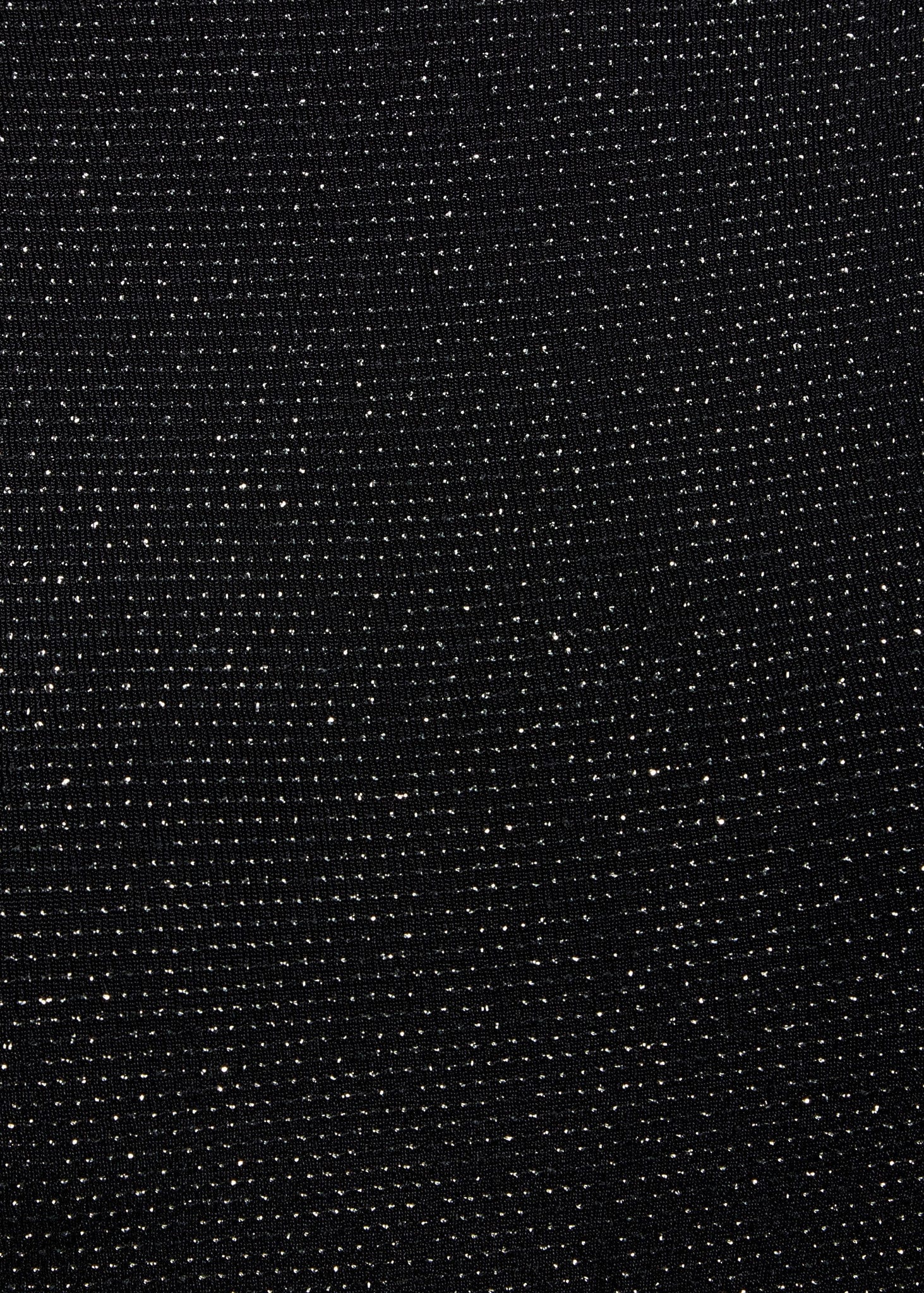 a close up of a Sarvin Black Cowl Back Gown with dots on it.