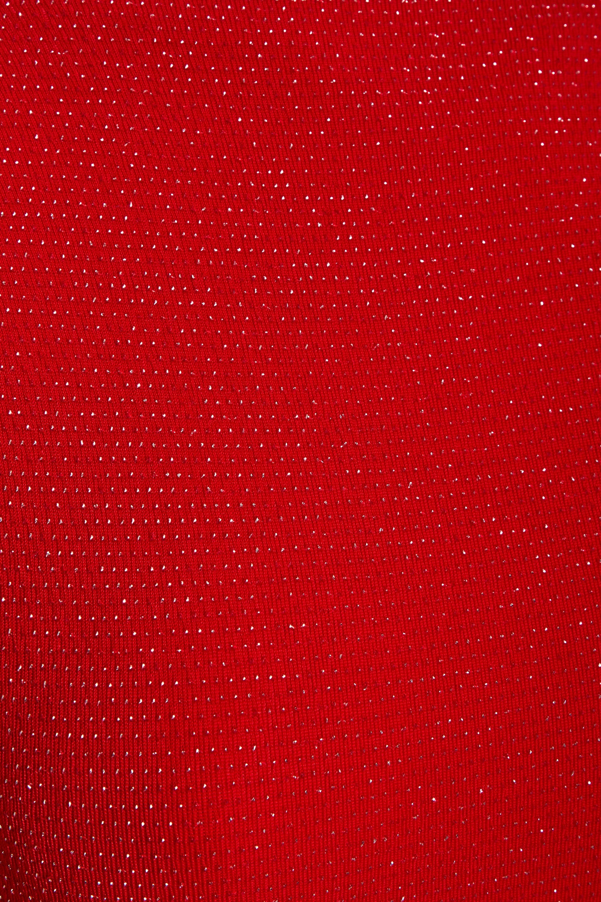 a close up of a Sarvin Red Cowl Back Gown.